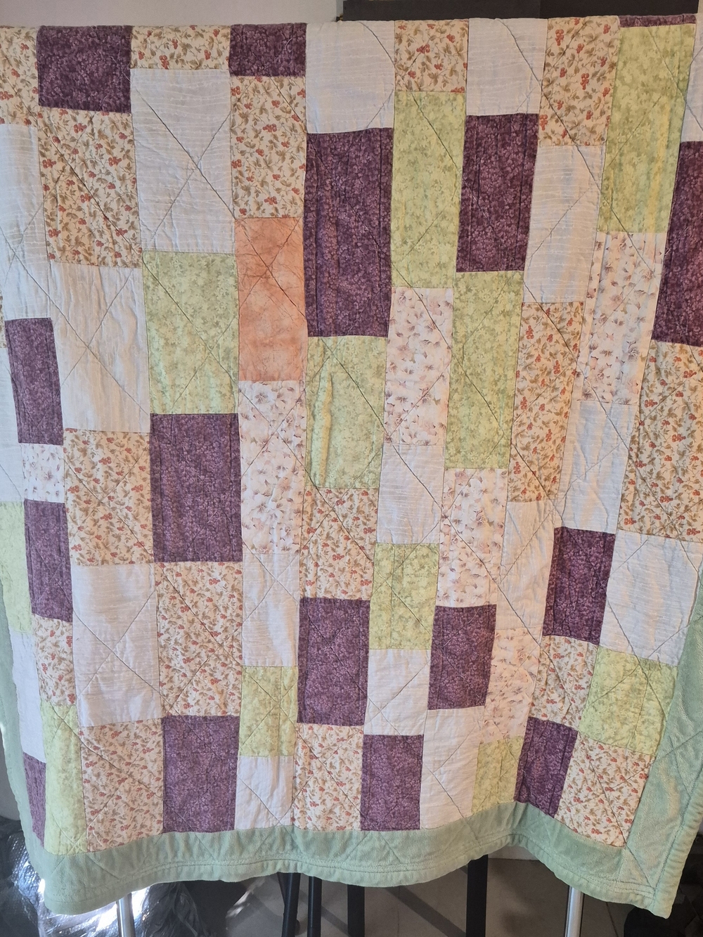 Patchwork Quilt in Purple, Green, and Cream - Cozy Floral Block Design